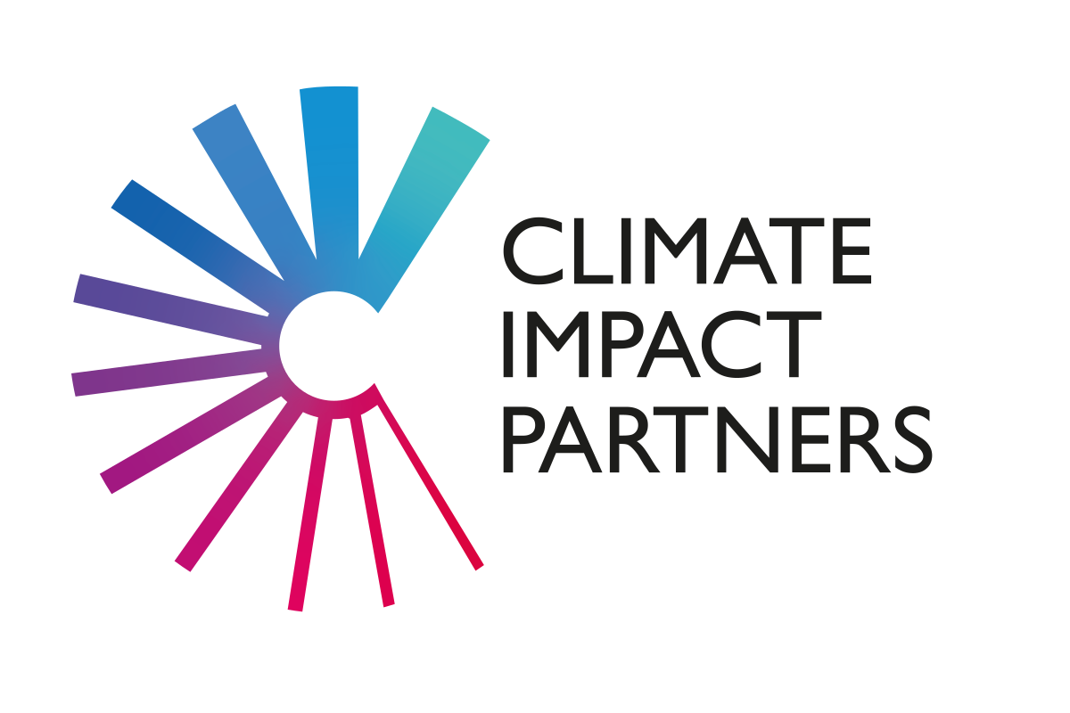 Climate Impact Partners discussing sustainability strategies at a conference table with charts and graphs visible in the b...