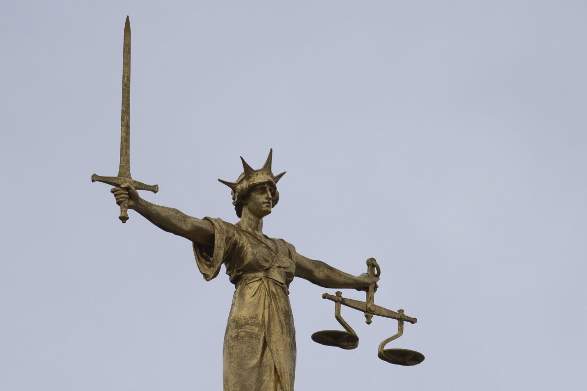 LONDON, ENGLAND - JANUARY 19: A statue of the Scales of Justice stands above the Old Bailey on January 19, 2021 in London, England. Criminal watchdogs representing England and Wales have expressed concern over the backlog of cases, caused by the Coronavirus pandemic. Figures have revealed that the backlog of unheard cases in the crown courts has reached 54,000. (Photo by Dan Kitwood/Getty Images)