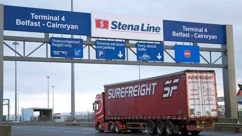 A lorry arriving at Larne port. There is a sign for Terminal 4 Belfast-Cainryan and Stena Line.