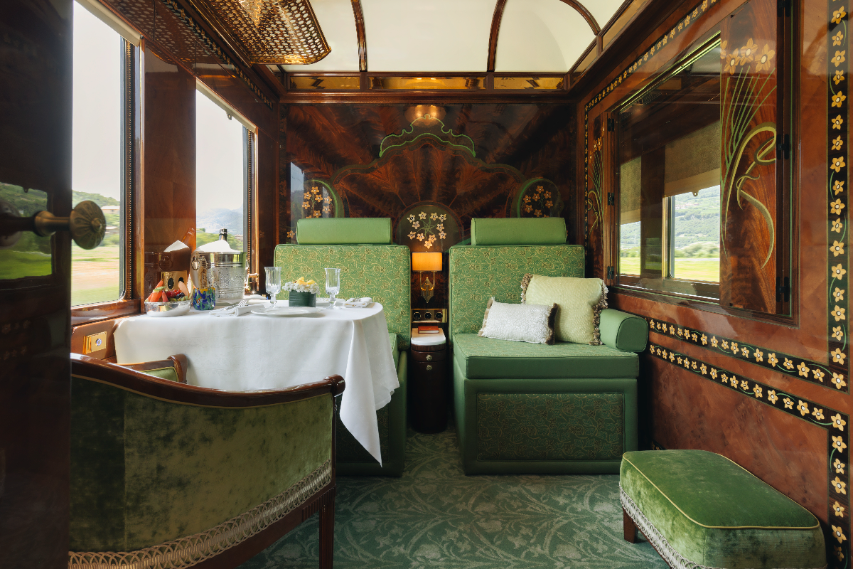 Scenic view from a luxury train journey through lush landscapes, showcasing one of the worlds top train travel experiences.